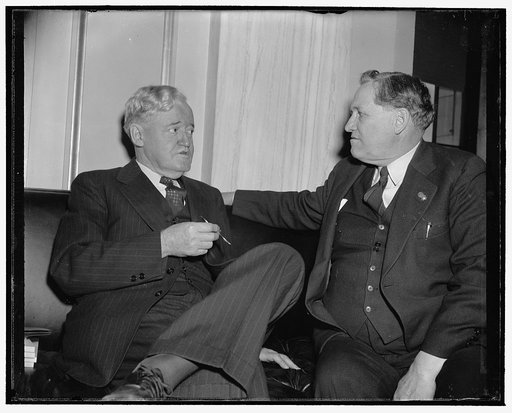 New Senator meets old timer. Washington, D.C., Dec. 28. Senator Clyde M. Reed, Republican elect from Kansas, after a press conference and session with photographers, found time to have some words with ex-Senator Smith W. Brookhart, Republican from Iowa who served from 1923-33, 12/28/38