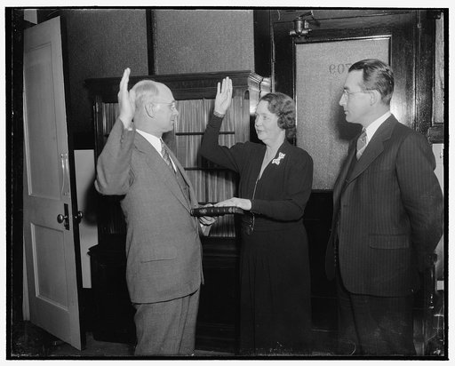 New member of Social Security Board takes oath of office. Washington, D.C., Dec. 30. Mrs. Ellen S. Woodward, former Assistant WPA Administrator, was today sworn in as a member of the Social Security Board. She succeeds Miss Mary Dewson, resigned. Left to right: George E. Scott, Chief of Appointment 