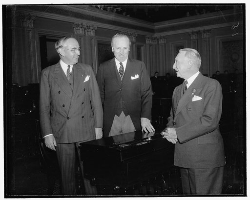 Early arrivals on Senate floor. Washington, D.C., Jan. 3. Among the early arrivals on the Senate floor today for the convening of the 76th session were, left to right: Senator Walter F. George of Georgia, Senator Henry F. Ashurst of Arizona, and Senator Arthur M. Vandenberg of Michigan, 1/3/39