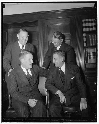 Alex Barry and James Mott, seated. Ben S. Fisher and Guy Cordoni, standing