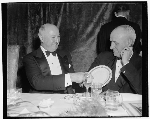 Here it is: price $100. Washington, D.C., Jan. 7. 'This' says Postmaster General James A. Farley, 'is the $100 Jackson Day Dinner plate.' O. Max Gardiner, former Governor of North Carolina, seems to wonder if it's worth it, 1/7/39