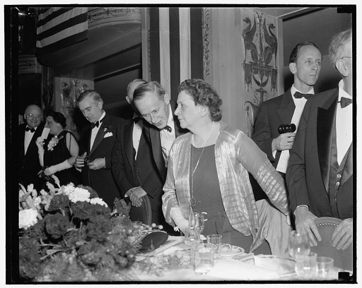 Hopkins tells Mrs. Perkins about it. Washington, D.C., Jan. 7. Harry Hopkins, Secretary of Commerce, stepped over to Labor Secretary Francis Perkins to tell her that he likes his new job. [...] was at the Jackson Day Dinner, 1/7/39