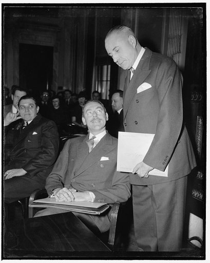 Counsel for Frankfurter talks with Chairman of Senate Judiciary Subcommittee. Washington, D.C., Jan. 10. Waiting to appear before the Senate Judiciary Subcommittee today as counsel for Prof. Felix Frankfurter, Dean Acheson, left, former Undersecretary of the Treasury and a personal friend of the Har