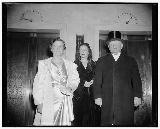 Guest of honor leaves for White House function. Washington, D.C., Jan. 10. Only twice a year will the Vice President put on his 'soup and fish'--the Jackson Day dinner and the President's dinner for the Vice President. Here he is leaving for the latter function in company with Mrs. Garner and his gr