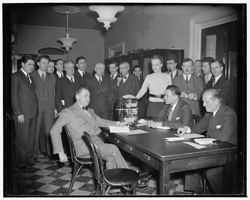 Congress' reporters hold own elections. Washington, D.C., Jan. 20. The biennial election of press galleries of the House and Senate today cast ballots to elect a standing committee of five to supervise management of the two press galleries during the next two years. Here, Harriet Evans, casts her ba