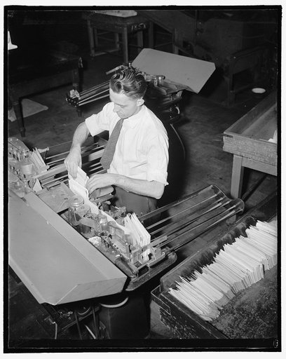 Canceling machine at P.O. Free to Congressmen, no. 9. Congressmen lick no stamps. They simply put their mail in envelopes and drop them in the chute, and when they reach the post office, they are run through the canceling machine just like postage-paid mail