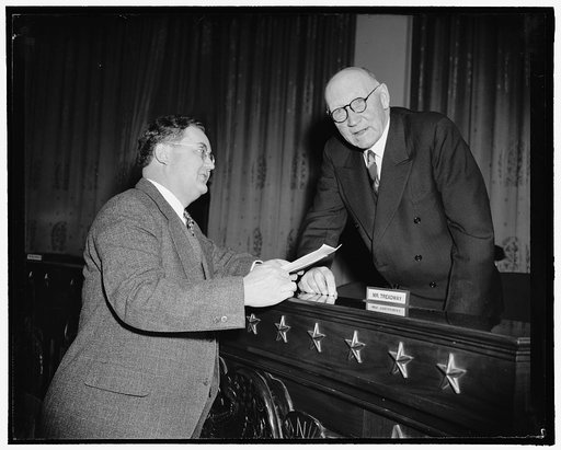 Texas Representative talk on his pension bill. Washington, D.C., Feb. 3. Representative Wright Patman, Texas, shown here with Robert L. Doughton, Chairman of the House Ways and Means Committee, today briefly told the committee of his bill, H.R. 105, introduced Jan. 3, to provide $30 a month to eligi