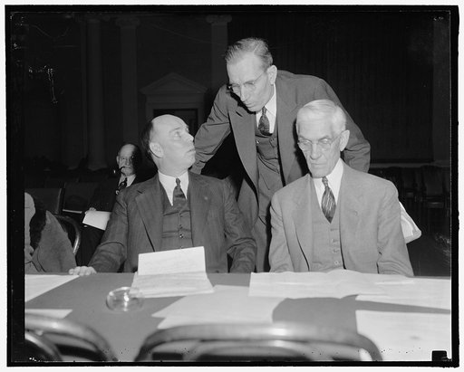 Townsendites have a day at hearings. Washington, D.C., Feb. 8. Rep. Ralph O. Brewster, Maine, L.W. Jeffery, Vice President of the Townsend National Recovery Plan, Inc. and Dr. Towsend, going over a few points on their testimony before the hearings today of the House Ways and Means Committee. Rep. Br