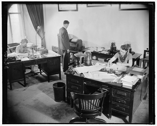 Archie Lockhead's office force with stock & bond tickers, 2-23-39