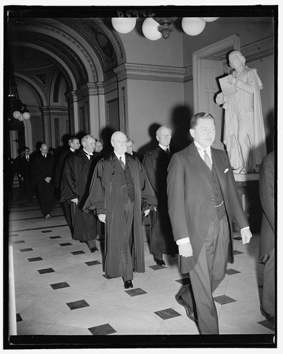 Entering House Chamber Room, Supreme Court Clerk of the Supreme Court Charles B. Cropley with Supreme Court Chief Justice Charles E. Hughes & James McReynolds. Directly behind Hughes is Pierce Butler. Joining 150th Congress ceremonies