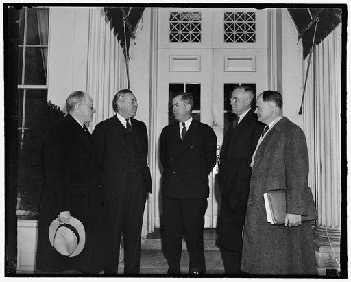 Henry A. Wallace, center
