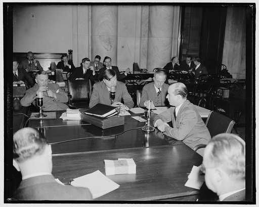 FAA challenger and FAA head meet again at hearing on monopoly. Washington, D.C., March 17. While Chief Counsels for the FTC and FAA interrogated him, Lionel Marks, President of Wm. Jameson and Co., Inc. sat before the Monopoly Committee and countered questions again with the Federal Alcohol Administ