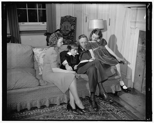 Newest Supreme Court appointee and family. Washington, D.C., March 20. Mrs. William Douglas, William, Jr., William Sr., and daughter Mildred Riddle at home tonight as they posed for photographs, following a day of excitement at the SEC when the President announced Mr. Douglas as his newest appointee