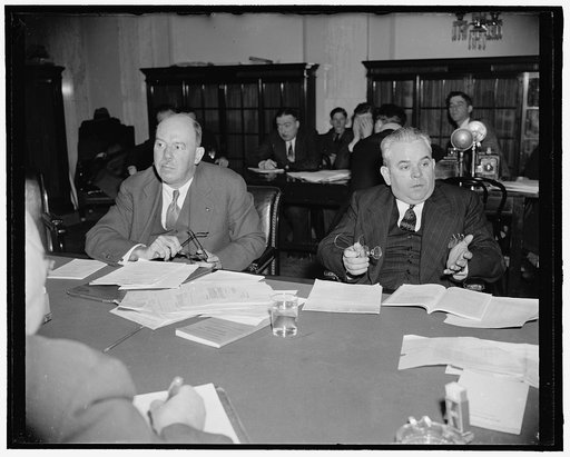Three million aliens in this country, senate committee told. Washington, D.C., March 21. Speaking for Secretary of Labor Perkins today before the Senate Immigration Subcommittee, Edward J. Shaughnessy, right, of the Immigration and Naturalization Service, declared that imposition of immigration quot