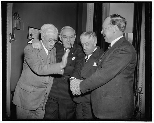 Michigan senator congratulated on 55th birthday. Washington, D.C., March 22. Senator Arthur M. Vandenberg, who is being prominently mentioned as the Republican Presidential Nominee in 1940, is pictured receiving the congratulations on his 55th birthday today from fellow Republicans in the Senate. Th