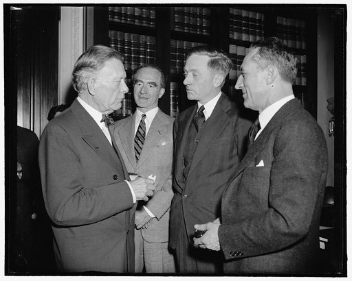 At Senate meeting where first move of Douglas's approval was made. Washington, D.C., March 24. Dean of the Senate, venerable Senator William Borah, Attorney General Frank Murphy, Supreme Court Appointee William O. Douglas and chairman of the Judiciary Sub Committee Carl A. Hatch had a pow-wow before