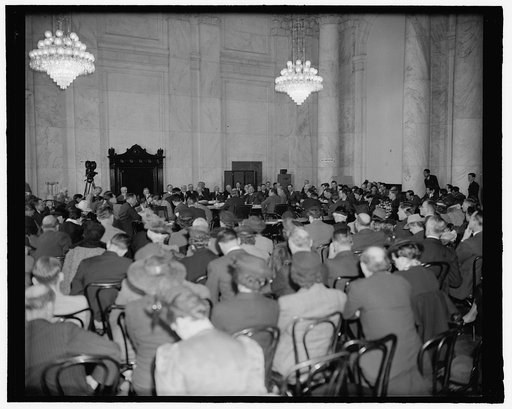 Crowd jams Senate hearing room to hear former Secretary of State criticize Neutrality Act. Washington, D.C., April 5. Before a well packed hearing room today former Secretary of State Henry L. Stimson warned the Senate Foreign Relations Committee that the present Neutrality Act is an instrument whic