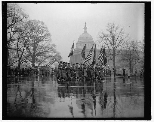 Rain fails to mar Army Day parade in Capitol. Washington, D.C., April 6. With the United States rearming and rumors of war in the air thousands braved a heavy rain today to witness the Army Day parade pass the U.S. Capitol. The parade marked the 22nd anniversary of America's entrance into the World 
