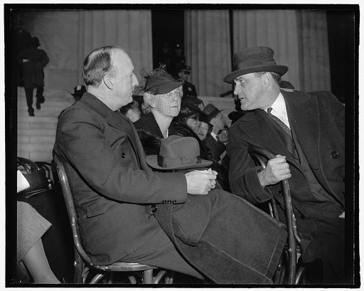Alabama's Supreme Court Justice and wife at negro singer's concert with Senator Sherman Minton. Washington, D.C., April 9. Supreme Court Justice Hugo Black, Mrs. Black, and Senator Sherman Minton talking together during intermission of Marian Anderson's open air concert at the Lincoln Memorial this 