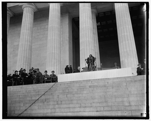 Washington's prominent figures listen to Marian Anderson's singing. Washington, D.C., April 9. Behind Marian Anderson, the heroic statue of Lincoln; beside her, Cabinet members and Senators; before her a crowd of 75,000 black and white listeners. Left to right - Secretary of the Treasury Henry Morge