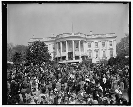 Youngsters jam White House lawn to roll Easter eggs. Washington, D.C., April 10. General view of the thousands of Youngsters who today took part in the traditional Easter egg rolling on the historic White House lawn. President and Mrs. Roosevelt greeted the children from the south portico. 4-10-39