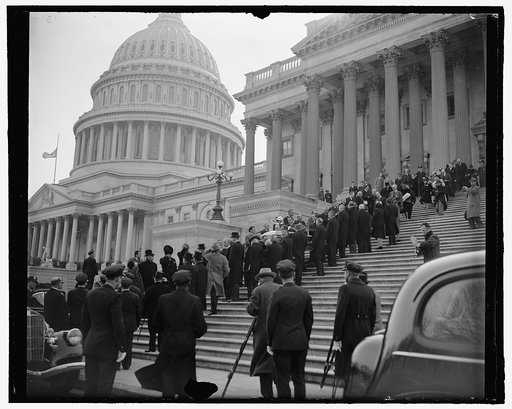 Body of Veteran Illinois Senator leaving Capitol for final resting place. Washington, D.C., April 12. Final rites for the late Senator from Illinois, J. Ham Lewis, were conducted today in the Senate chamber where the body lay in state. President Roosevelt, members of the Cabinet, U.S. Supreme Court 