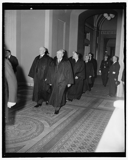 Supreme Court attends funeral services for late Illinois Senator. Washington, D.C., April 12. Members of the U.S. Supreme Court as they arrived for the funeral services for the late Senator J. Ham Lewis in the Senate chamber today. In the picture can be Justices Harlan F. Stone, James Clark Reynolds