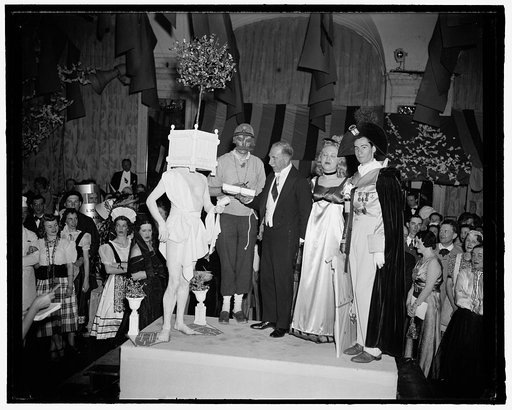 Costume prize winners at Arts Club's Bal Boheme. Washington, D.C., April 10. Washington's annual costume ball, the Bal Boheme, took as its theme this year, 'Paris au Printemps'. Highlight of the evening was presentation of prizes for costumes. The winners were given their prizes by Senator Theodore 