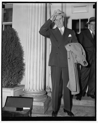 Kansas City district attorney sees President Roosevelt. Washington, D.C., April 18. Maurice Milligan, U.S. District Attorney in Kansas City, who is engaged in the income tax inquiry involving boss Tom Pendergast, photographed as he left the White House today. He said that he called only on a social 