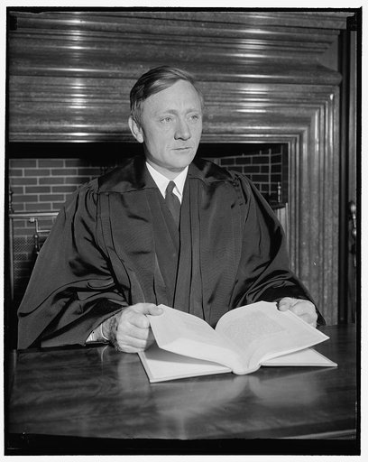 Douglas dons robes of Supreme Court Justice. Washington, D.C., April 17. William Orville Douglas, 40 year old successor to retired Justice Louis D. Brandeis, today donned the robes of an associate Justice of the Supreme Court and took his place on the bench at noon today. Here he is in his new robes