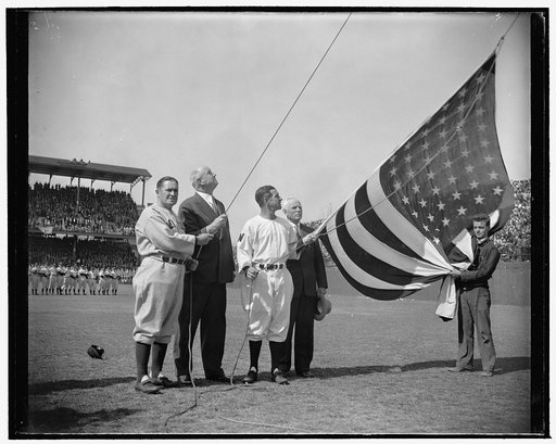 Postmaster General raises flag and officially opens baseball season. Washington, D.C., April 21. The game can't start until the flag is raised over the field, and here are Yankee manager Joe McCarthy, Postmaster General James A. Farley, National's Manager Bucky Harris, and Clark Griffith, owner of t