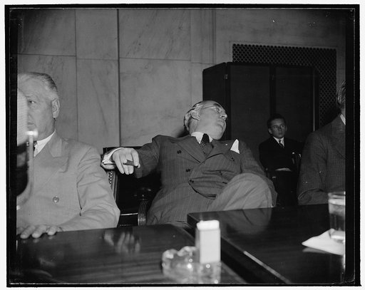 Michigan Senator relaxes. Washington, D.C., April 27. Republican Senator Arthur M. Vandenberg, of Michigan, relaxes as he listens to testimony before the Senate Foreign Relations Committee today