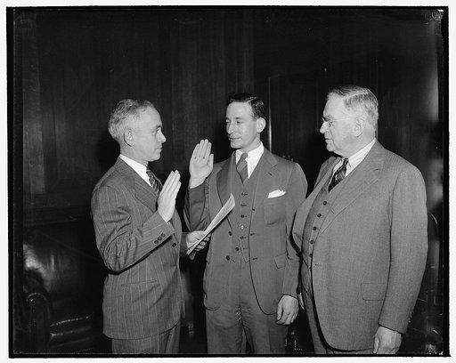 Ickes commissions new general counsel of FEA. Washington, D.C., May 1. Administrator Harold Ickes presenting Abe Fortas, newly appointed General Counsel of the Federal Emergency Administration of Public Works with his commission after Fortas was sworn into office today