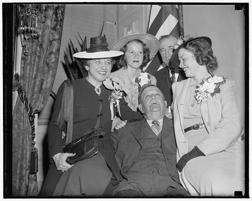 Azalea beauties welcomed at Capitol. Washington, D.C., May 2. South Carolina Senators Ellison D. 'Cotton Ed' Smith, seated, and Joseph F. Byrnes, standing, gave a royal welcome to the bevy of beauties visiting Washington today after presiding at the Azalea Festival in Charlestown, South Carolina. Th
