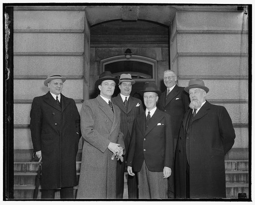Finnish Trade Delegation visits State Department. Washington, D.C., May 3. Little Finland which pays its bills, today was represented at the State Department by a trade delegation which paid a friendly visit. The group called upon Secretary Hull. Left to right, front: H.J. Procope, Envoy Extraordina