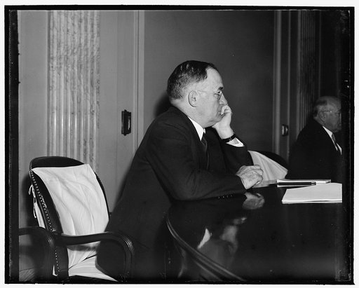 Nebraska Senator studies. Washington, D.C., May 15. Senator Edward R. Burke, from Nebraska, photographed as he listened to testimony given by William Leiserson this morning at the meeting of the Senate Education and Labor Committee