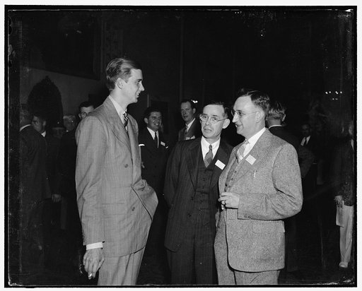 President's youngest son attends businessmen's forum. Washington, D.C., May 22. John Roosevelt, youngest son of President and Mrs. Roosevelt, who is now connected with a large department store in Boston, is here attending the Retailer's National Forum at the Mayflower. He is pictured with W.F. Carte