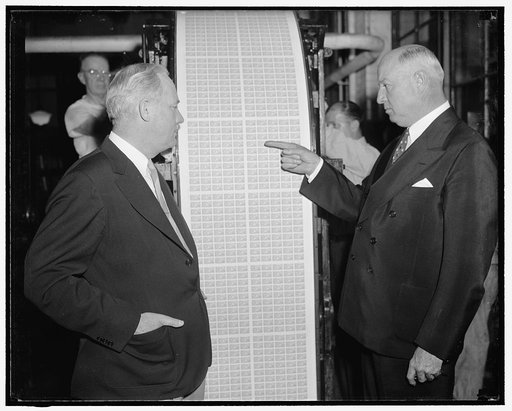 First baseball stamp comes off press. Washington, D.C., May 26. Postmaster General James. A. Farley points to the first batch of the new baseball stamps as they come off the press at the Bureau of Engraving and Printing today. The stamp is being issued and will be first placed on sale at Cooperstown