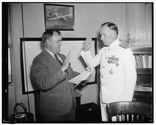 New Chief of Naval Aeronautics takes oath. Washington, D.C., June 1. The newly appointed Chief of Bureau of Aeronautics, U.S. Navy, Capt. John H. Towers, right, being administered the oath of office today by John B. May, Chief Clerk of the Navy Department. The promotion automatically carries with it