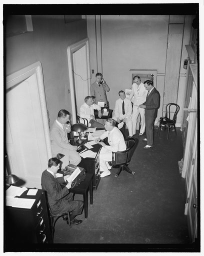 Radio news gatherers in new quarters at Capitol. Washington, D.C., June 26. A group of radio news reporters at work in their new quarters across the hall from the House Chamber in the Capitol. The room was made over for radio press after its leader, Fulton Lewis, Jr., had almost single-handedly carr