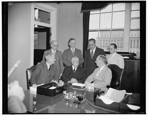 Admiral Leahy confers with Puerto Rican officials about new post as Governor. Washington, D.C., June 14. Admiral William D. Leahy, who is scheduled to be the next governor of Puerto Rico met today at his office with a group of Puerto Rican political leaders to discuss his new post. Left to right: Ma