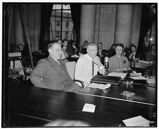 Before Monopoly Committee. Washington, D.C., June 29. R.R. Rogers, left, Vice President of the Prudential Life Insurance Co., today told the Monopoly Committee Investigating Insurance Company Setups that reduction of interest and amortization rates on homes would stimulate sale of houses but would n