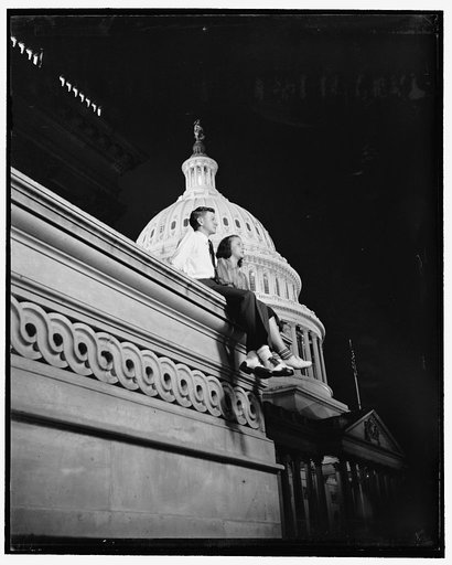 Light in Capitol dome means pages have to work at night. Washington, D.C., July 1. When the light is burning in the dome of the Capitol, it signifies that Congress is holding a night session. To pages, this means night work- no dates. Democratic Page of the House Mac Arnold is here looking glum with