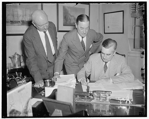 Naval increase on the way. Washington, D.C., June 2. Assist. Secretary of the Navy, Charles Edison, today signed final confirmation on awards to private shipyards for the construction of twenty-four naval vessels totaling 159,800 tons. Approximate cost will be $350,000,000. Picture shows, left to ri