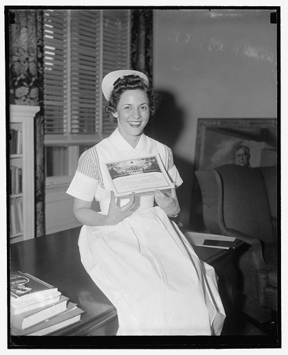 First aid certificate no. 2,000,000. Washington, D.C., July 8. Ann Miller, pretty student nurse, from new Philadelphia, Ohio, was yesterday awarded the 2,000,000th Red Cross first aid certificate at Red Cross headquarters here