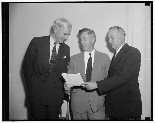 Discuss cotton export program. Washington, D.C., July 13. In the spotlight at today's conference of Cotton Trade and Textile Industry Representatives were Will Clayton, left, of Anderson-Clayton Co., Houston Texas; Secretary of Agriculture Henry A. Wallace, and Rep. Marvin Jones of Texas, Chairman o