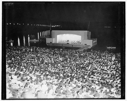 Washington turns out for open air music. Washington, D.C., July 12. Sitting on stone steps near the Lincoln Memorial here, and facing a barge moored in the Potomac River, thousands of Washingtonians turned out to listen to the first of a series of summer concerts by the Washington Symphony Orchestra