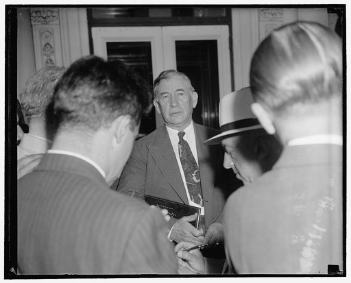 Nesmen question Senate majority leader as he leaves the White House. Washington, D.C., July 17. Emerging from a White House conference with President Roosevelt today, Senate majority leader Alben Barkley announced to reporters that 'no decision had been reached' on the next move in the congressional