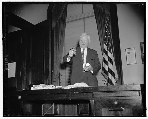 V-P Garner impatient for adjournment of Congress so we can go fishing in Texas. Here admitting a new fishing lure presented to him by the newsreel men covering the Capitol, Aug. 1939