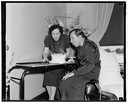 Mildred and Claude Pepper with cake